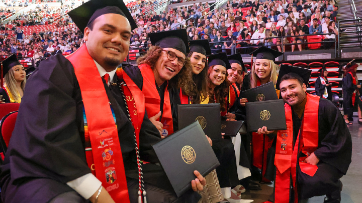 A file photo of SDSU students dressed in their caps and gowns during an SDSU commencement ceremony.