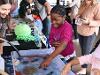 A young student smiles while exploring marine creatures at the 2025 San Diego Festival of Science and Engineering. (Bryana Quintana/SDSU)