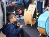 A young festival attendee peers at a sunspotter device. (Bryana Quintana/SDSU)