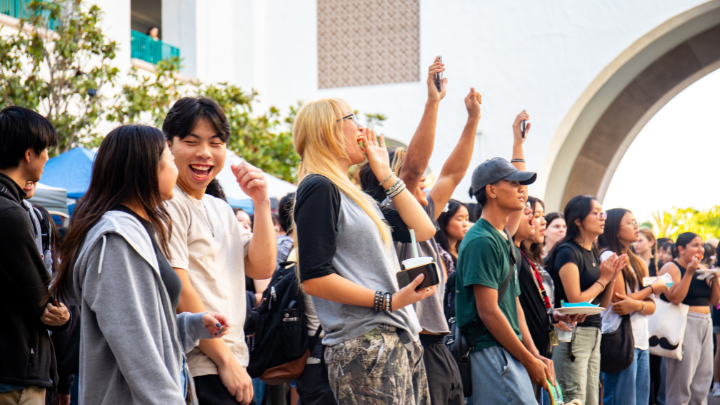 a group of people celebrating in a group