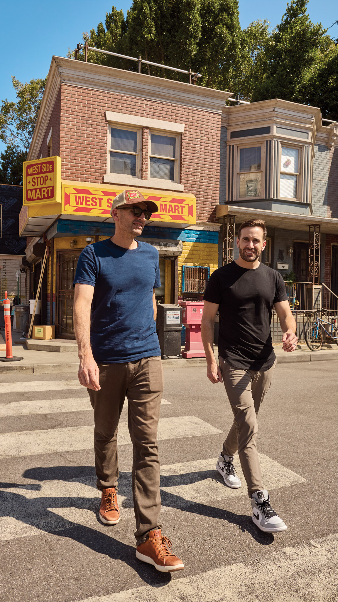 2 Men walking across a street