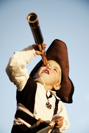 A young boy plays pirate.