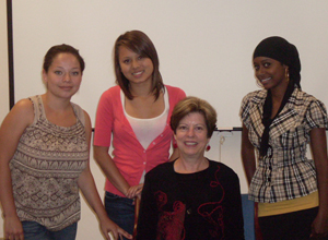 From left: Arely Cano, Lan Anh Dam, and Nasro Salan with Sandra Cook (seated)