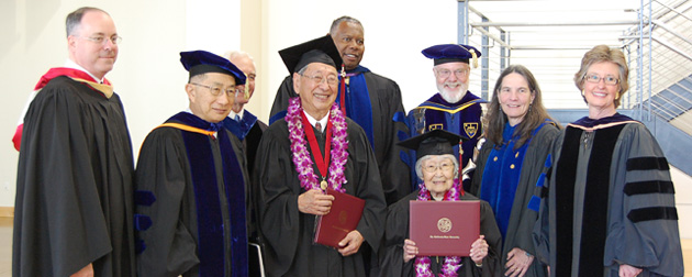 Carl Yoshimine (left, holding degree) and June Junko Kushino (right, holding degree)