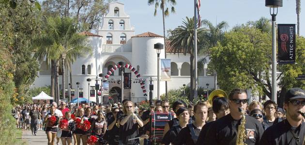 The SDSU Marching Band escorts Aztecs from Hepner Hall to Viejas Arena.