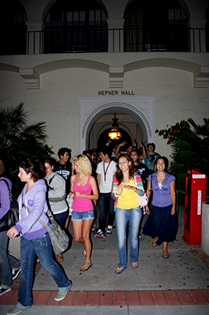 Students walk through Hepner Hall as part of the Templo del Sol event.