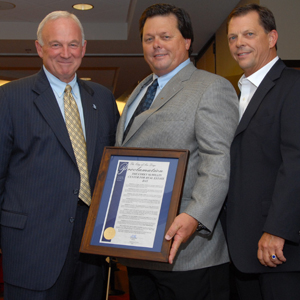 From left: Mayor Jerry Sanders, Mark McMillin and Scott McMillin pose with the mayor's declaration.