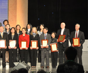 Large group accepting Confucius Institute of the Year awards