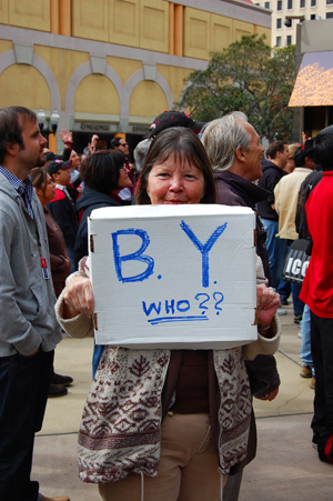 An SDSU fan asks an important question at the rally held downtown Friday.
