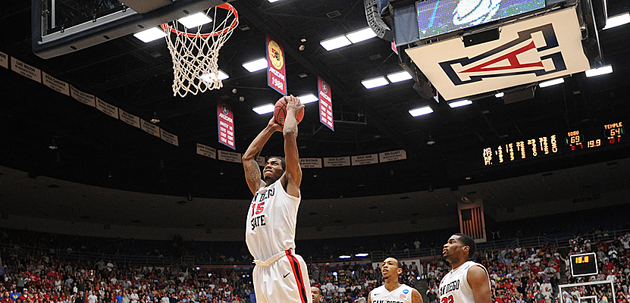Kawhi Leonard dunks with authority to seal the Aztecs 71-64 double-overtime win vs. Temple. Photo by Ernie Anderson.
