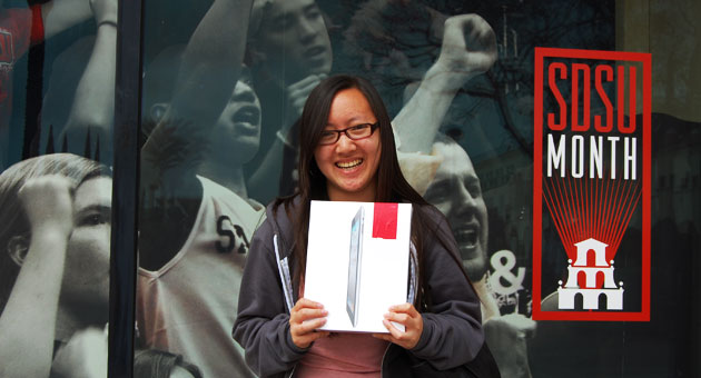 SDSU sophomore Nina Lee proudly holds her new iPad2.