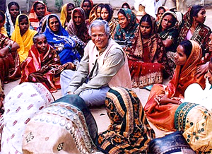 Muhammad Yunus (center) visits Grameen Bank Centers and loan holders, who are mostly women. Photo courtesty of Grameen Bank Audio Visual Unit, 2006