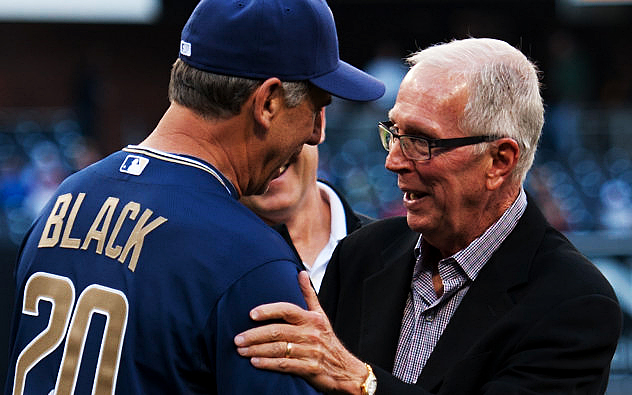 Aztecs basketball coach Steve Fisher shares a moment with Padres manager and SDSU alumnus Bud Black.