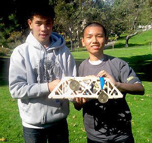 Hoover High students Thong Dinh and Tri Tran show off their gold medal-winning project in the Southern California Regional MESA Competition.