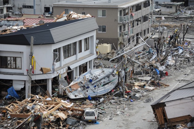 US Navy Photo: A fishing boat is among debris in Ofunato, Japan, following a 9.0 magnitude earthquake and subsequent tsunami