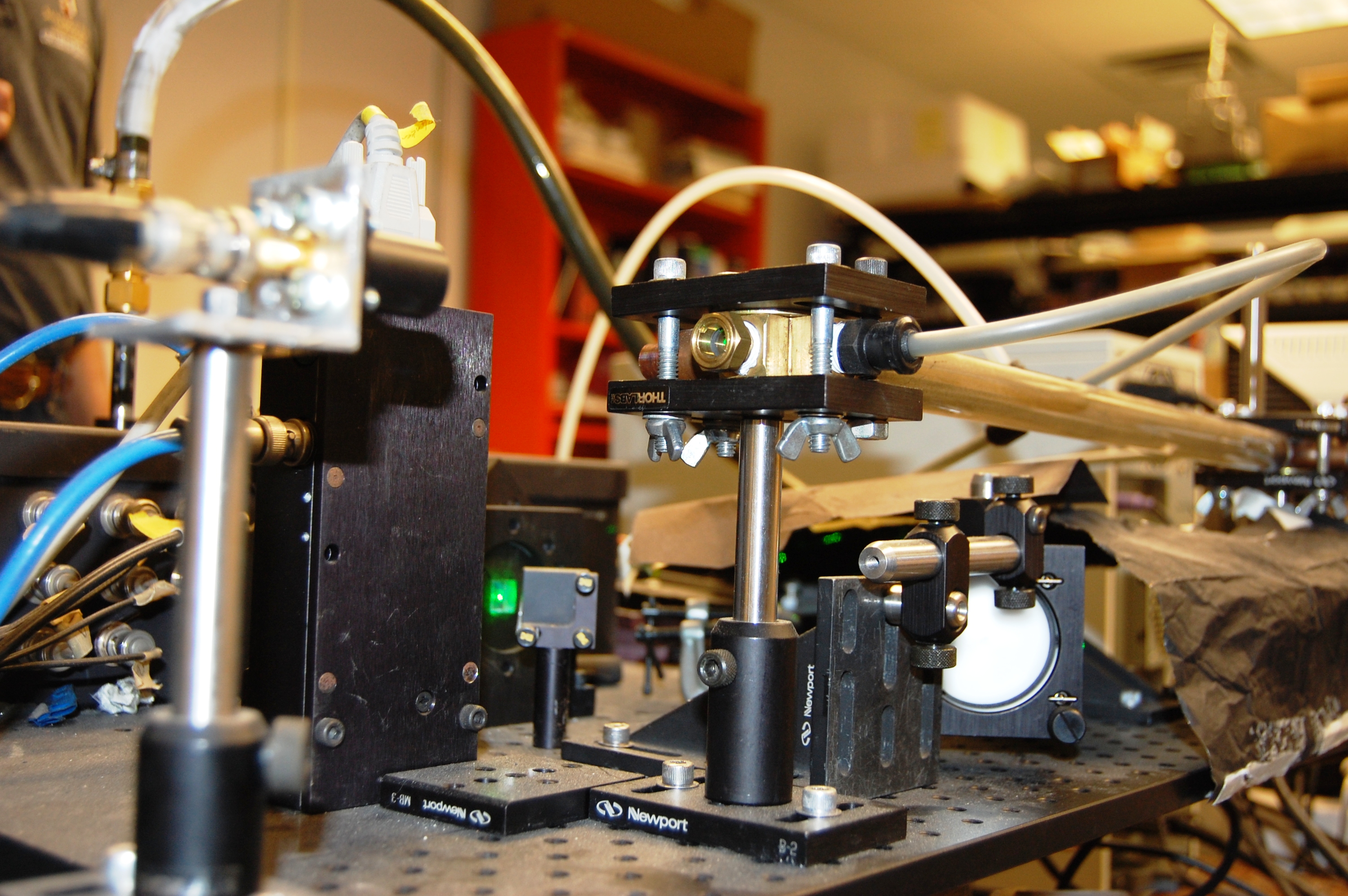 A laser is used in the particle generation process to create carbon nano particles.