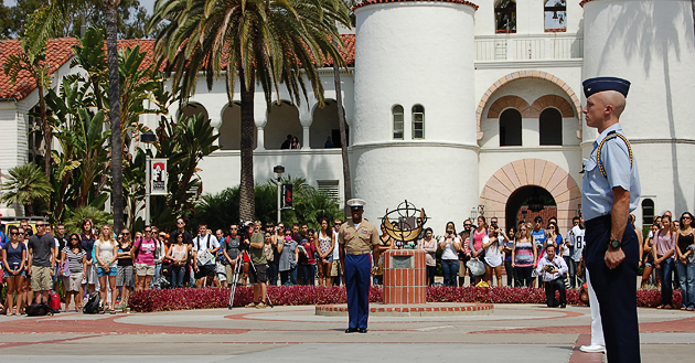 Hundreds of students gather at the 9/11 memorial ceremony held at the flagpole near Hepner Hall.