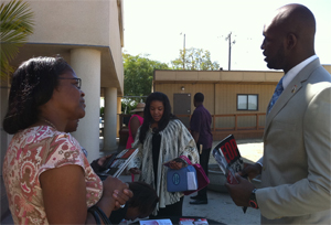Trimaine Davis speaks with family during Super Sunday event