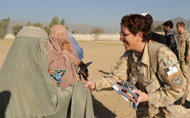 A female soldier speaks with an Afghan woman. Photo courtesy of Afghanistan International Security Assistance Force, NATO