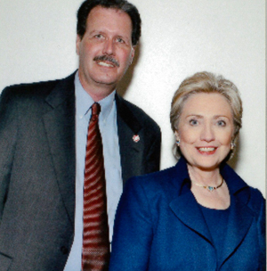SDSU Police Detective Chris Jacobsen stands with Hillary Clinton during her 2008 presidential campaign event at SDSU.