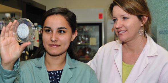 Undergraduate researcher Ellese Carmona, left, works with SDSU biology professor Kelly Doran.
