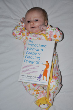 Baby holding book: The Impatient Woman's Guide to Getting Pregnant