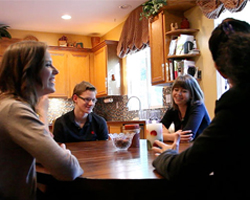 Keren, Ross and Cara at home in their kitchen.