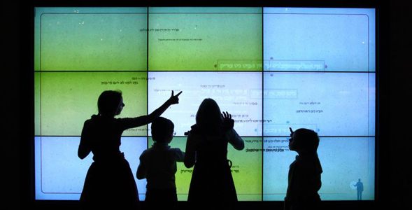 Visitors to the Jewish Museum and Tolerance Center touch an interactive screen to learn about Jewish history.