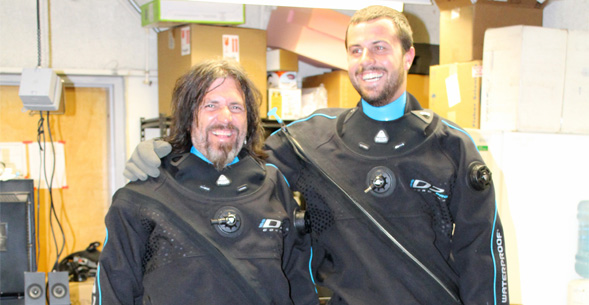 Forest Rohwer (left) and Steven Quistad try on dry suits in preparation for their trip to the Arctic.