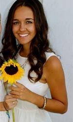 Maria C with a sunflower