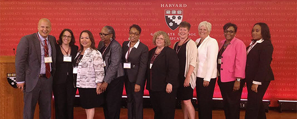Trish Hatch (third from right) and Laura Owen (fifth from right) at Harvard.