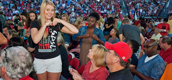 A student receives her SDSU pin at the 2013 New Student and Family Convocation ceremony.
