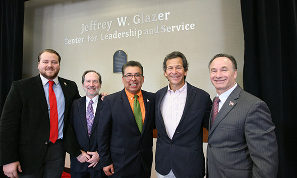Left to right: J. Cole, Dean Geoff Chase, Eric Rivera, Jeff Glazer and President Elliot Hirshman during the signing ceremony.