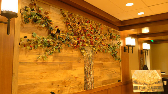 Artist Aida Valencia created a glass and stone mosaic of the sycamore tree that grew in Aztec Center.