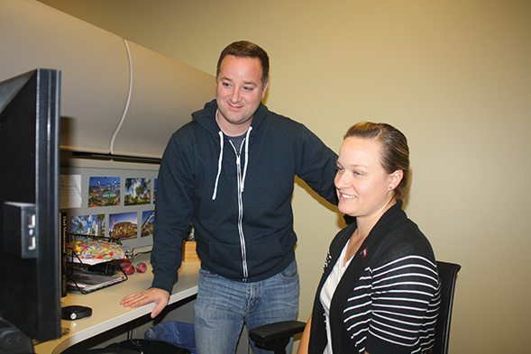 SDSU's Electronic Solicitation Manager Dan Majors ('03) and Vanessa Horne ('03) prepare for the Great Give on Oct. 24. (Photo: Tobin Vaughn)