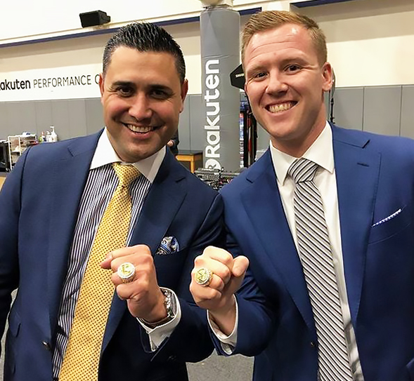 Mike Kitts (left) and Dominic Lucq show off their 2017 NBA Championship rings.