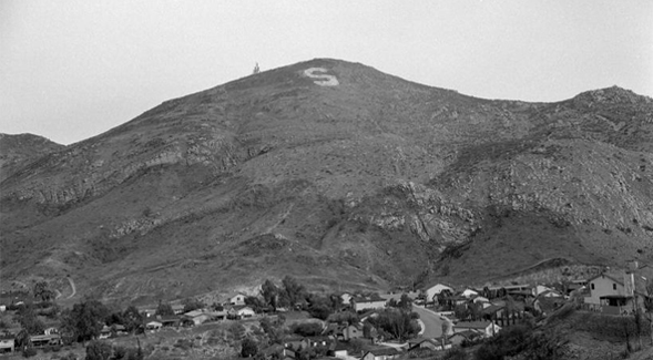 The S symbol appears on Cowles Mountain with the San Carlos neighborhood below. (Credit: SDSU Special Collections and University Archives)