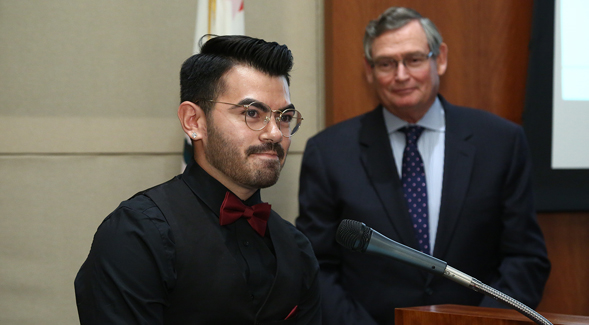 Manuel Gonzales IV with CSU Chancellor Timothy P. White in the background (Credit: CSU)