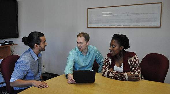 Math education professor Daniel Reinholz works on the EQUIP app with two doctoral students, Amelia Stone-Johnstone and Antonio Martinez.