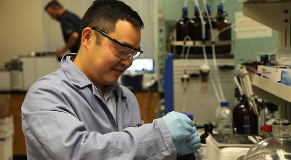 Chemistry professor Yong Yan in his lab studying the photocatalyst perovskite.