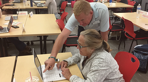 Cajon Valley School District teacher Val Donaldson received guidance from instructor Matthew Evans at the Coding for Teachers workshop.