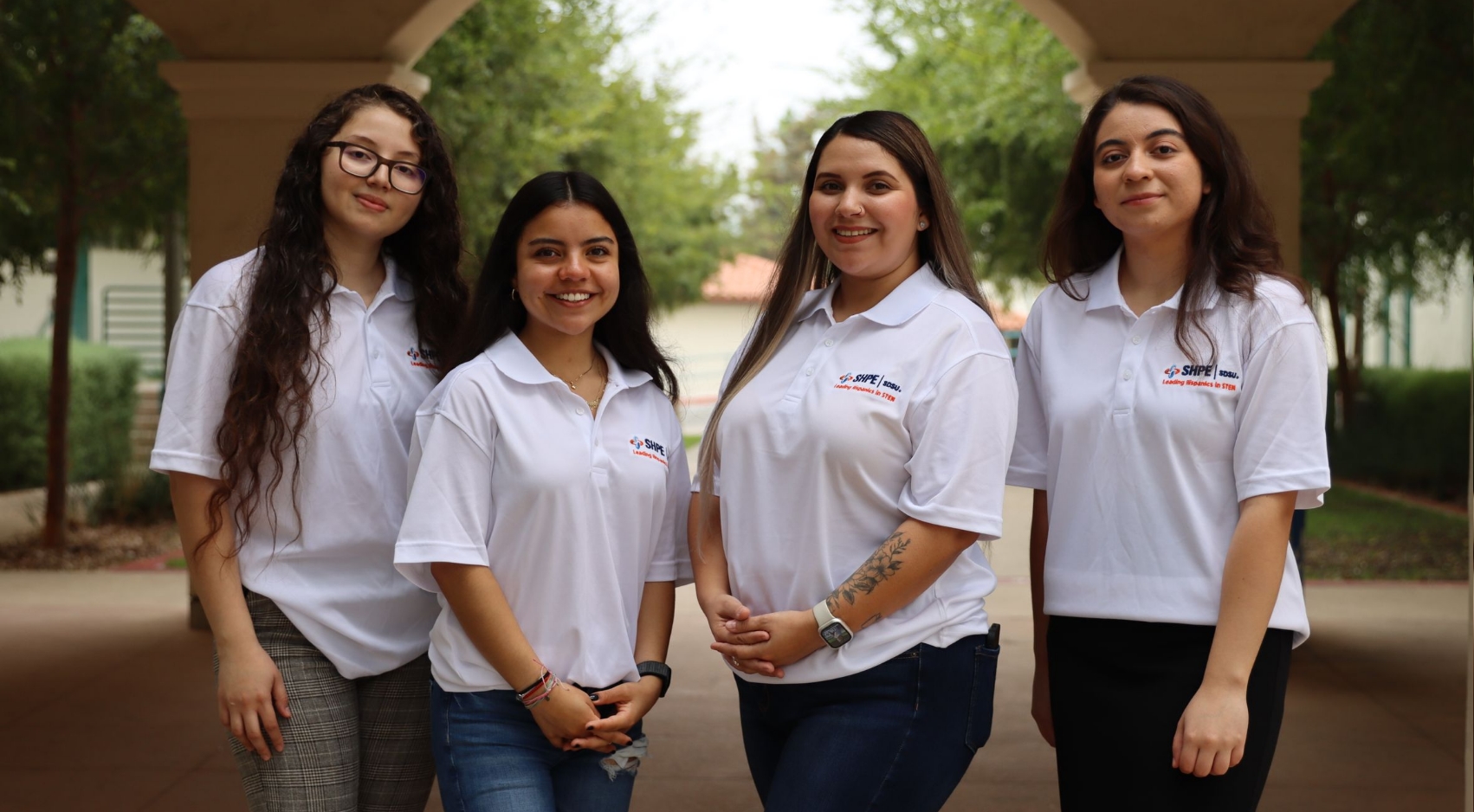 (From left) SDSU Engineering Students Jeanette Arratia, Karla Navarrete, Arely Nieblas, and Bernice Gudino posed in their SHPE polos. (SDSU)