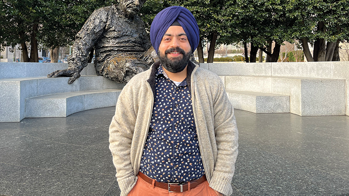  Professor Amneet Bhalla standing in front of the Albert Einstein memorial in Washington, D.C. 