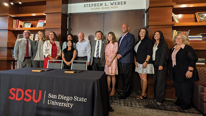 SDSU president is joined by leaders of the SDUSD during a creremony celebrating the agreement that establishes guaranteed admission for qualified Hoover High graduates