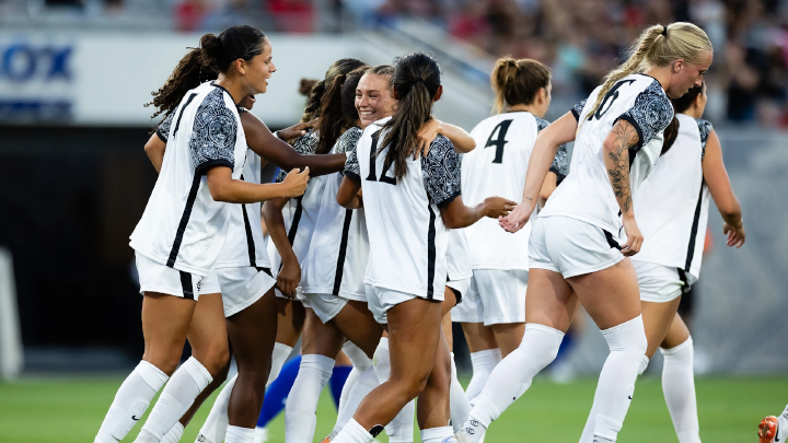 The SDSU women's soccer team celebrate their season opening match win on the field at Snapdragon Stadium.