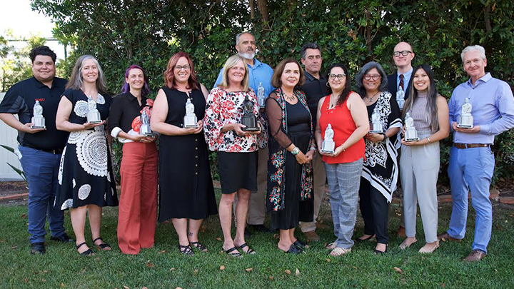 SDSU's outstanding staff recipients pose for a photographed with SDSU President Adela de la Torre. (SDSU)