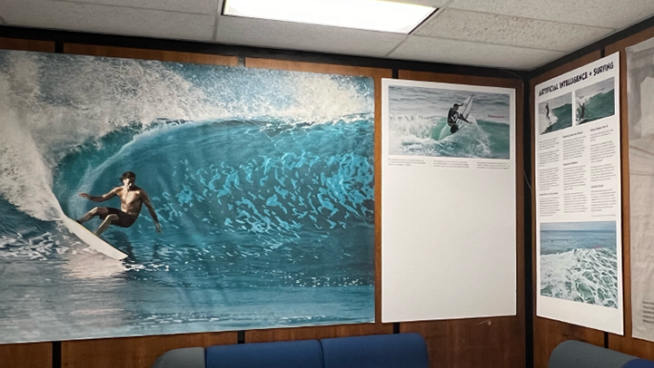 Part of the Science of Surfing Exhibit shows a surfer shredding a wave.