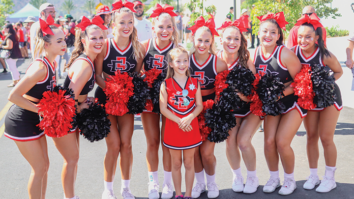 SDSU's spirit squad leads Snapdragon Stadium fans in a cheer.