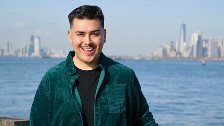 SDSU alumnus Kevin Perez photographed in front of the New York City skyline, where he is attending NYU.