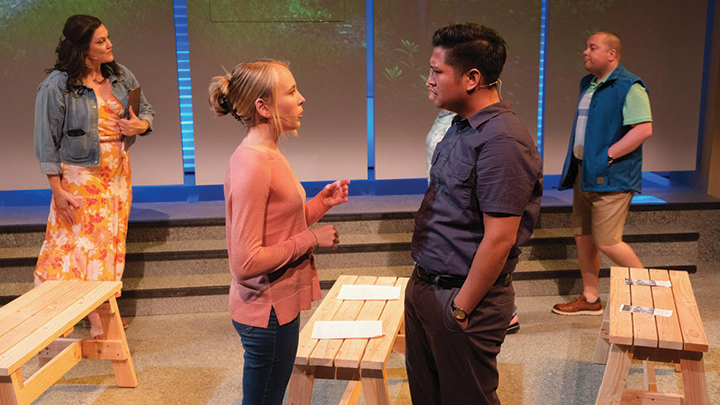 Image shows Audrey Deubig performing during the SDSU School of Theatre, Television, and Film's 2022 world premiere of "Postcard American Town"